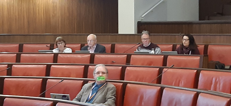 Cllr Keith Kondakor with green tape over his mouth at last week's meeting (image by LDRS)