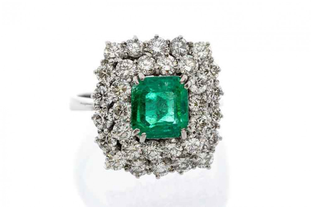 Sold for £2,000, an emerald and diamond dress ring Sold for £2,000, an emerald and diamond dress ring