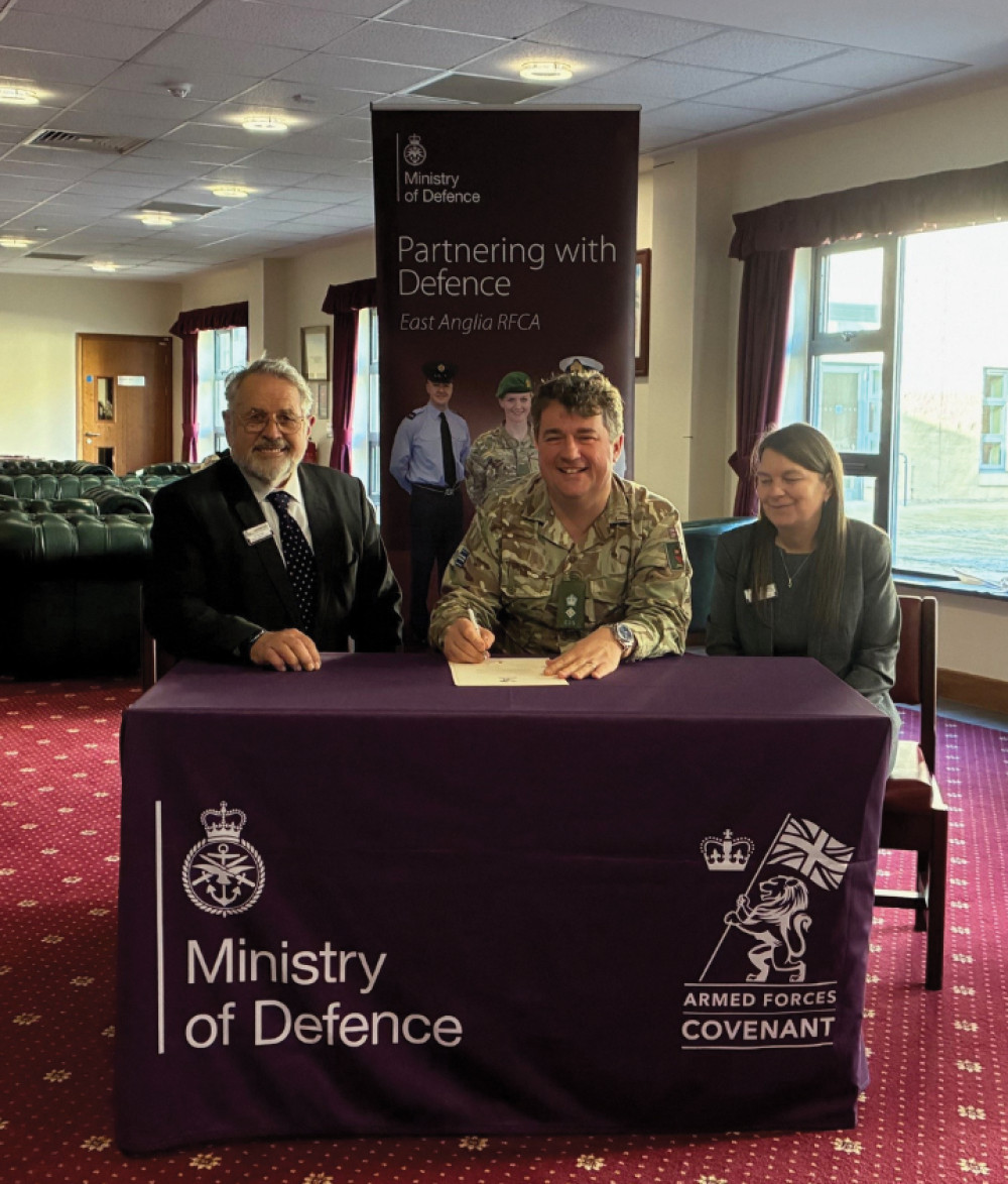  Cllr Ron Pratt, Sue Green, and Lieutenant Colonel Ed Rankin signing the armed forces covenant pledge at Colchester barracks