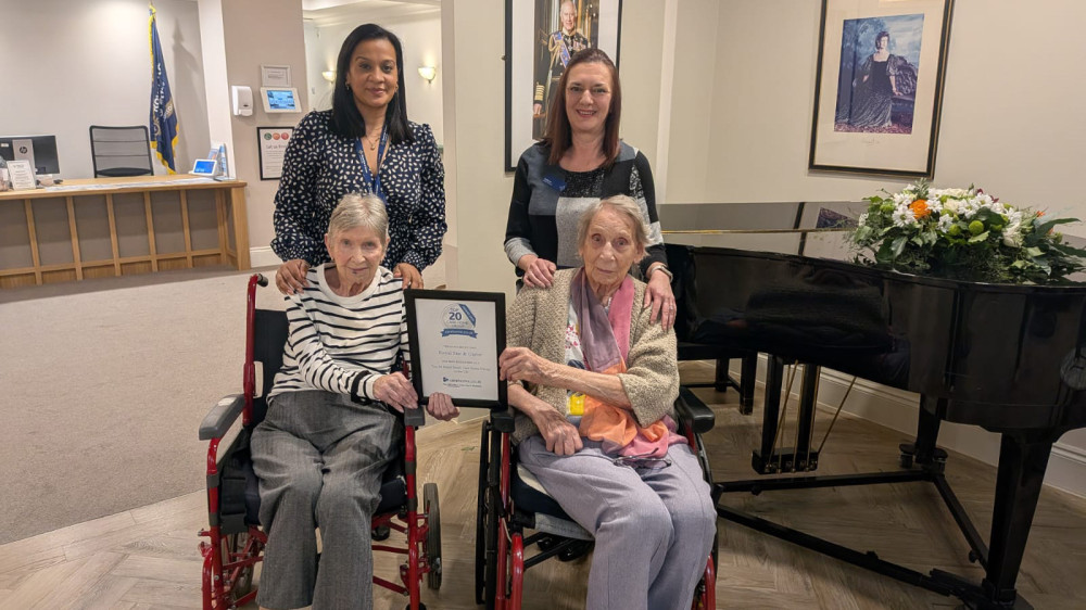 Royal Star & Garter, Surbiton Deputy Home Manager Yasmin and Home Manager Helena, holding the Top 20 Award certificate with residents Maureen and Shirley (Credit: Royal Star & Garter)