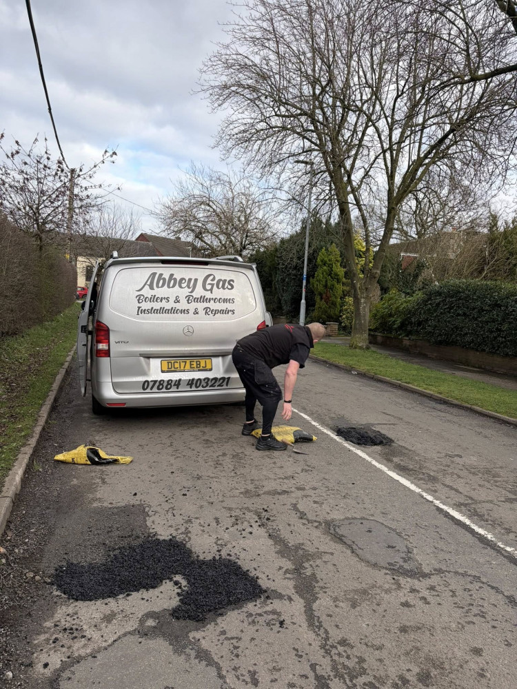 Alsager dad, Lee Beresford, was so fed up with the number of potholes in the road near his home that he's filled them himself. (Photo: Lee Beresford)