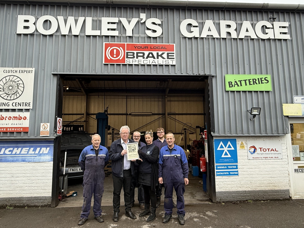 Philip Welch of Wells SOUP presents the owners and staff of Bowley’s Garage with a certificate of thanks for their sponsorship of this grant-giving lunch