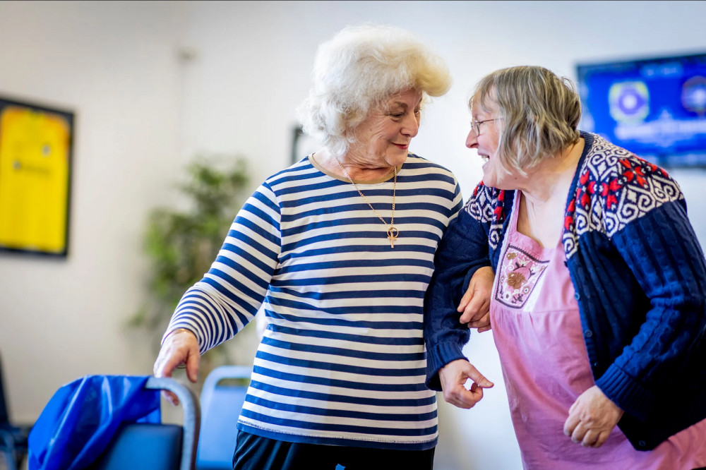 Age UK Somerset seeks volunteers in Street for its Wellbeing Friends and Walk and Talk programs, aiming to combat loneliness among older residents (Unsplash)
