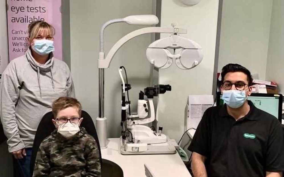 Alfie with mum Catherine and optician Adnan