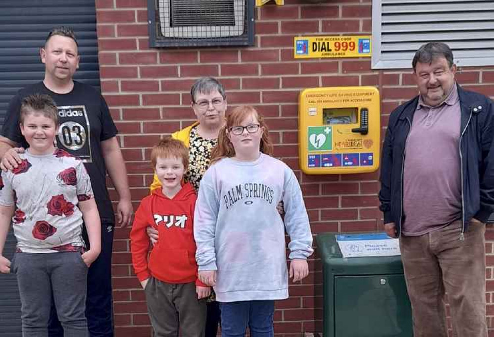 Councillor Gordon Rhind – far right with members of Midway  Youth Activities Group and the new defibrillator, from left – Devon Bates, Scott  Bates, Noah Robinson, Susan Cotton and Phoebe Robinson.