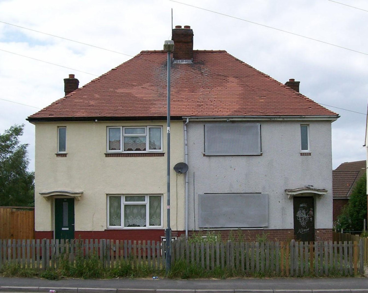 Somerset Council struggles to identify over 2,300 empty homes due to pending system development, relying on council tax records meanwhile, amid efforts to curb property vacancies.