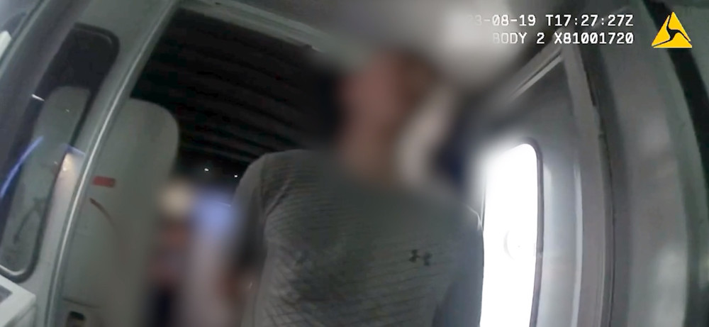 The moment Callum Coady was arrested at Manchester Airport after threatening to kill his ex-partner (Image - GMP)