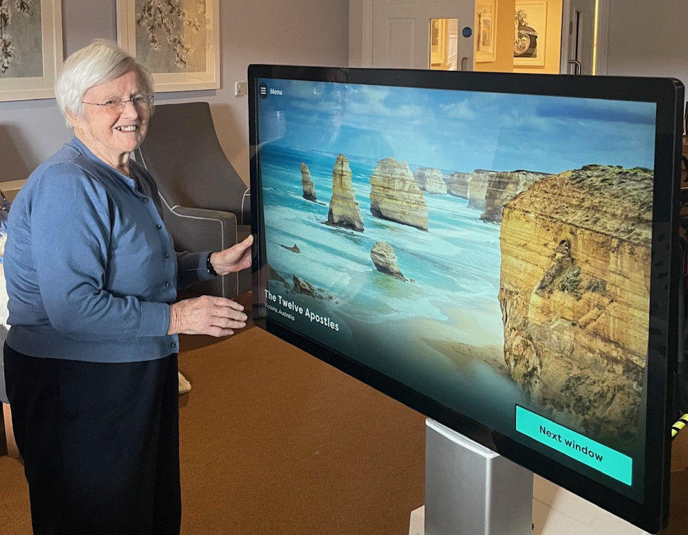 Crandon Springs Care Home resident Eileen played the swipe and guess game, slowly revealing different locations around the world.