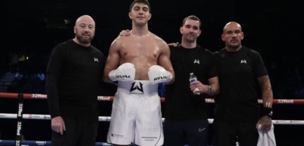 Lewis Williams in the ring (second left) (images via https://lewiswilliamsboxing.com/)