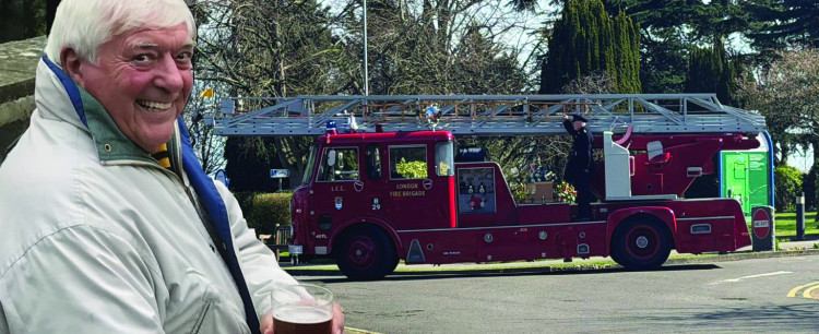 The fire appliance carring Lennie Ringshaw on his final journey with a guard of honour arrives at Corbets Tey. 