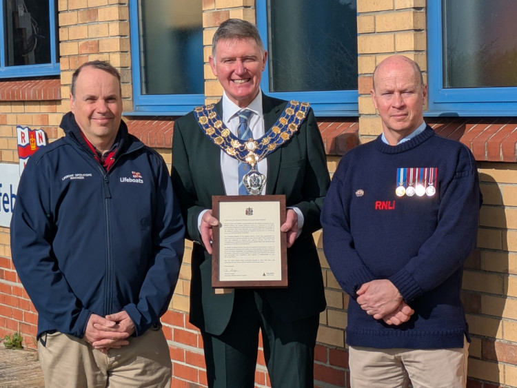 Chairman of Maldon District Council, Cllr Kevin Lagan with members of the RNLI team at Burnham. 