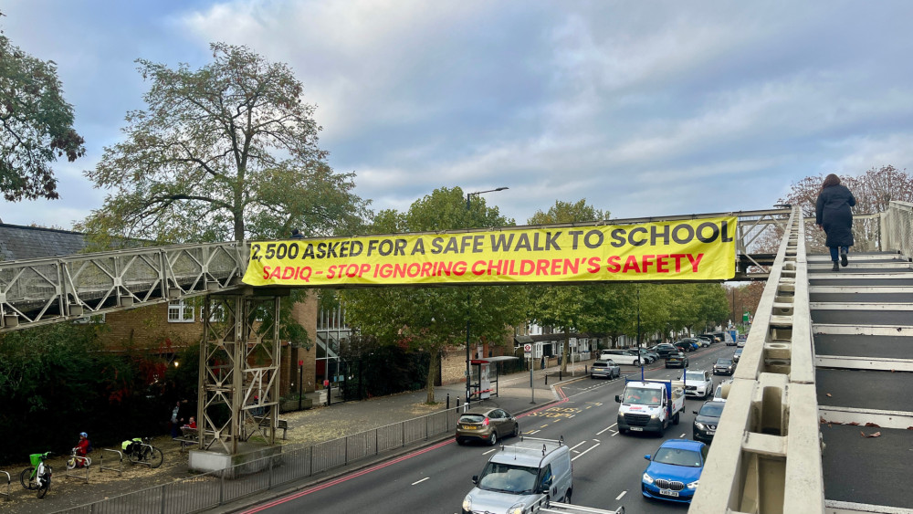 A banner from last year's protest by local parents calling for TfL and Sadiq Khan to improve road safety at A316 St Margarets roundabout (credit: Nub News). 