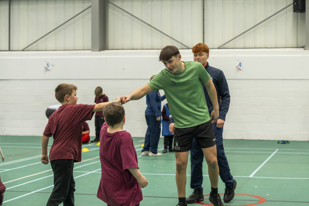 Millfield students lead a sports outreach program for Wookey Primary School, boosting children's confidence and engagement in diverse sports.