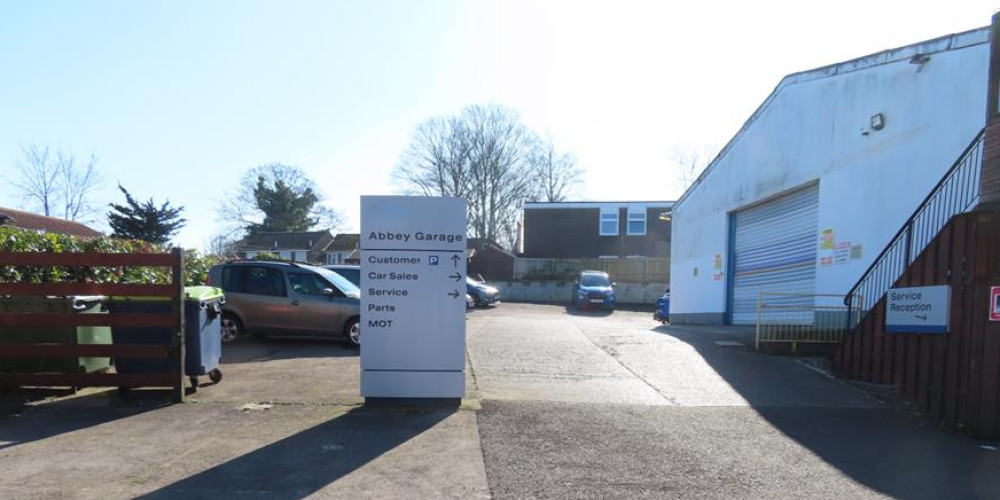 A new service station, shop, jet wash and EV bays are set for Abbey Garage after revised plans dropped flats from the scheme.