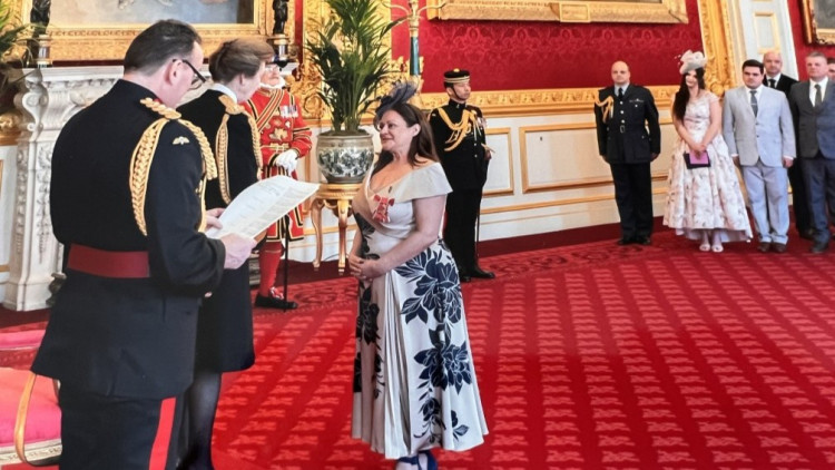 Ann-Marie Riley receives her OBE from Anne, Princess Royal (image via UHNM)
