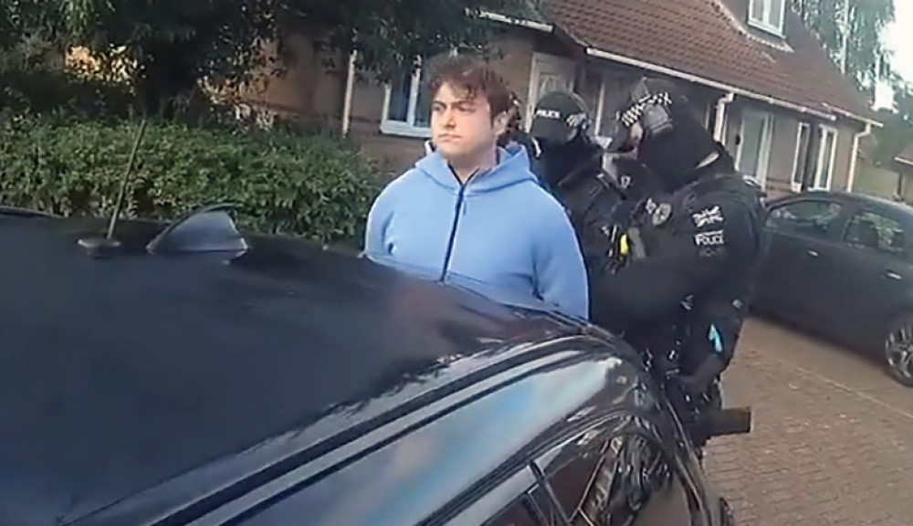 Sonny Carter was arrested by armed officers. 