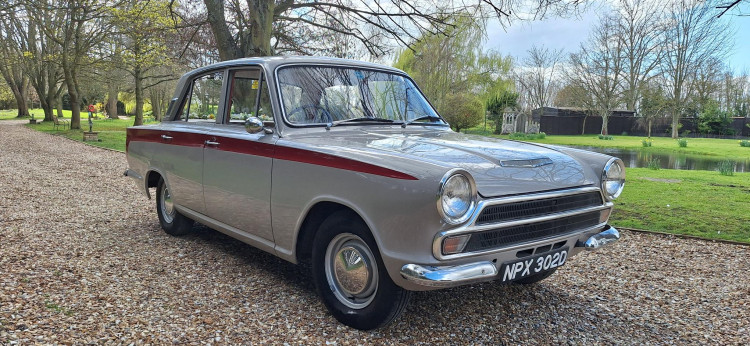 Its classic British styling – clean lines, chrome accents, and vintage appeal – creates a romantic, retro backdrop 