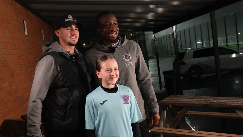 Stockport County stars Jack Diamond and forward Joseph Olowu presented the Spurley Hey players with their tickets in a surprise visit (Image - Vertu)