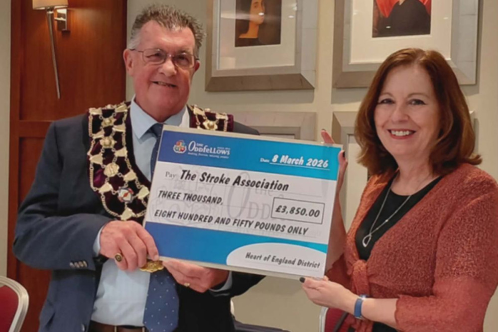 Image: Heart of England Chairman Keith Newton presents a cheque to Kathy Baxter, Stroke Association Support Co-ordinator (image supplied) 