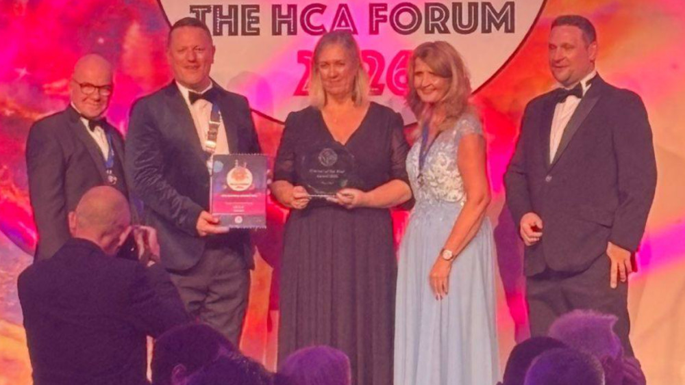 Erica Bell (centre) receives her  HCA award (Image - Stockport NHSFT)