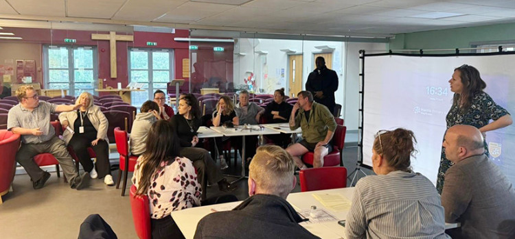 Cllr Aaron Green (left) makes a point to jen Craft (right) and attendees at the meeting. 