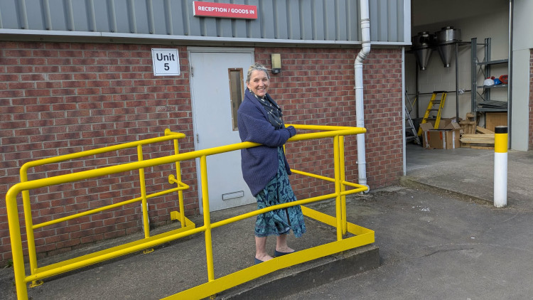 Badged owner, Lisa Simpson, outside the new premises the company will be moving to on the Springvale Industrial Estate. (Photo: Nub News)
