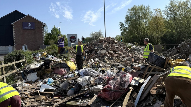 Volunteers, led by Andy Denham, cleared fly-tipped waste from Red Brick Building land in Glastonbury, transforming the site in a single day. (Photo: Red Brick Building) 