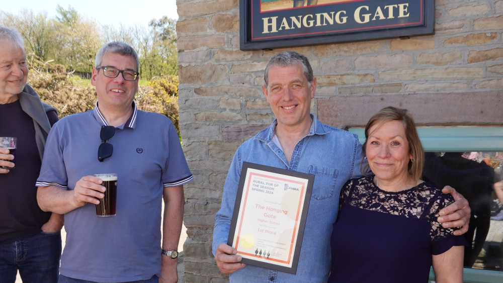 Macclesfield and East Cheshire CAMRA chair Dave Gittins with the Hanging Gate owners James Schofield and Hilary Spokes (Credit: Supplied)