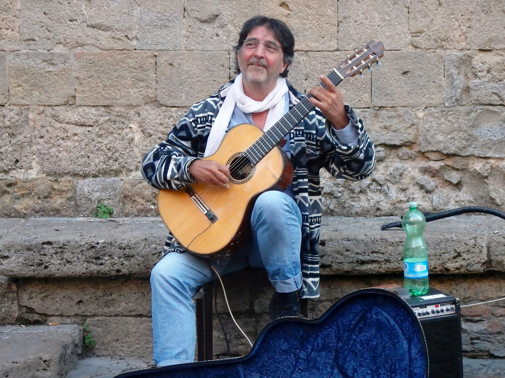 Shepton Mallet Friday Market seeks local entertainers, acoustic performers, and buskers to enhance the market's atmosphere with music and energy. (Unsplash) 