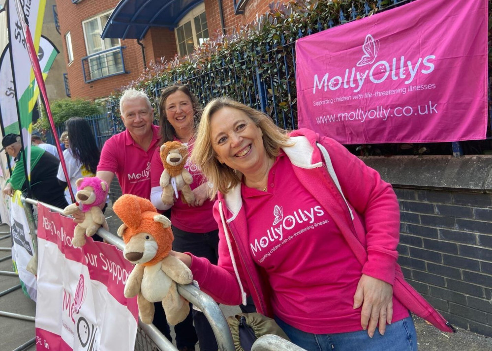 Molly Ollys team Rachel and Tim Ollerenshaw (back)  supporting runners with Sue Herbert (front)  (image supplied)