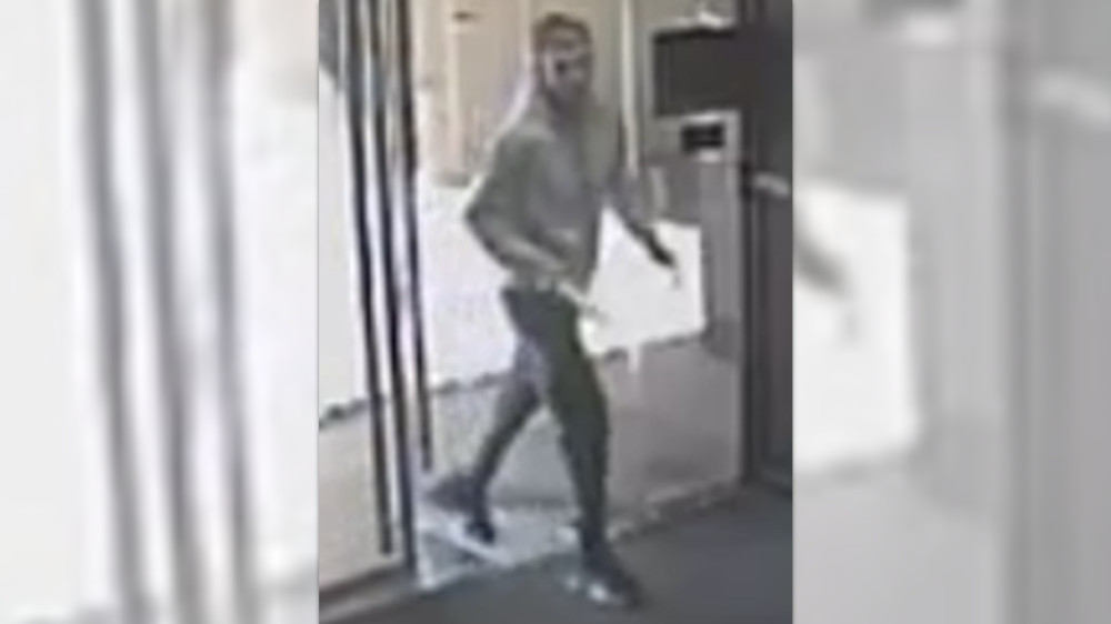 Police would like to speak with the man in the picture as they believe he could help in an investigation into a parcel theft (Image via GMP)