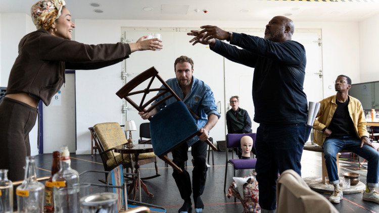 Joe Bannister (centre) alongside castmates during rehearsals of Orange Tree Theatre's Black Comedy (credit: Sam Taylor).