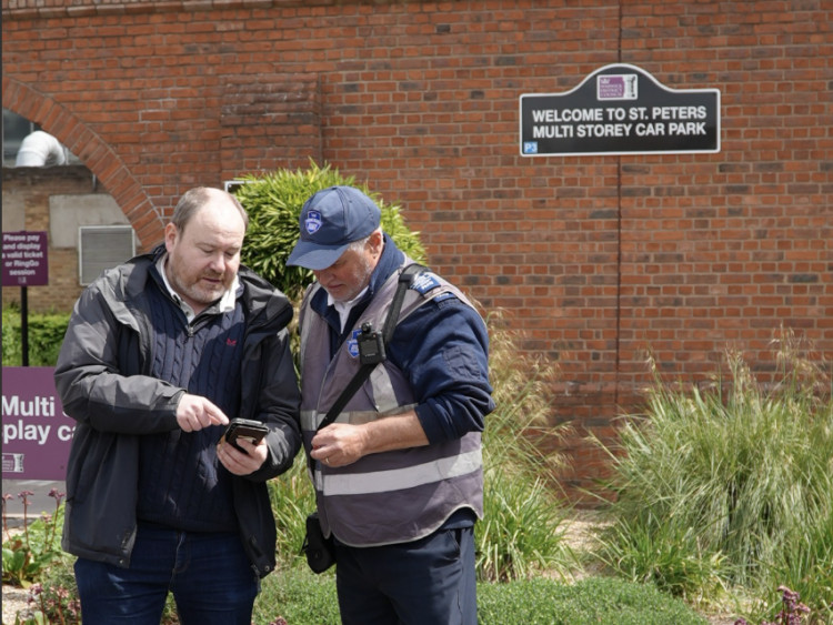Cllr Will Roberts is shown the NPP by a WDC Parking Warden (image supplied) 