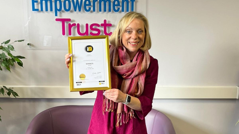 CEO of Staffordshire Women's Aid, Charlotte Almond with the award (image via Staffordshire Women's Aid)