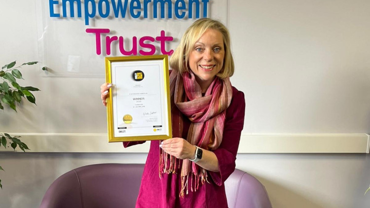 CEO of Staffordshire Women's Aid, Charlotte Almond with the award (image via Staffordshire Women's Aid)