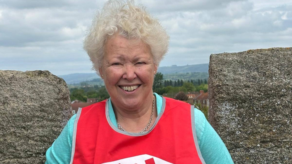 Liz at the top of the church tower (Photo: GoFundMe/St Ben's) 
