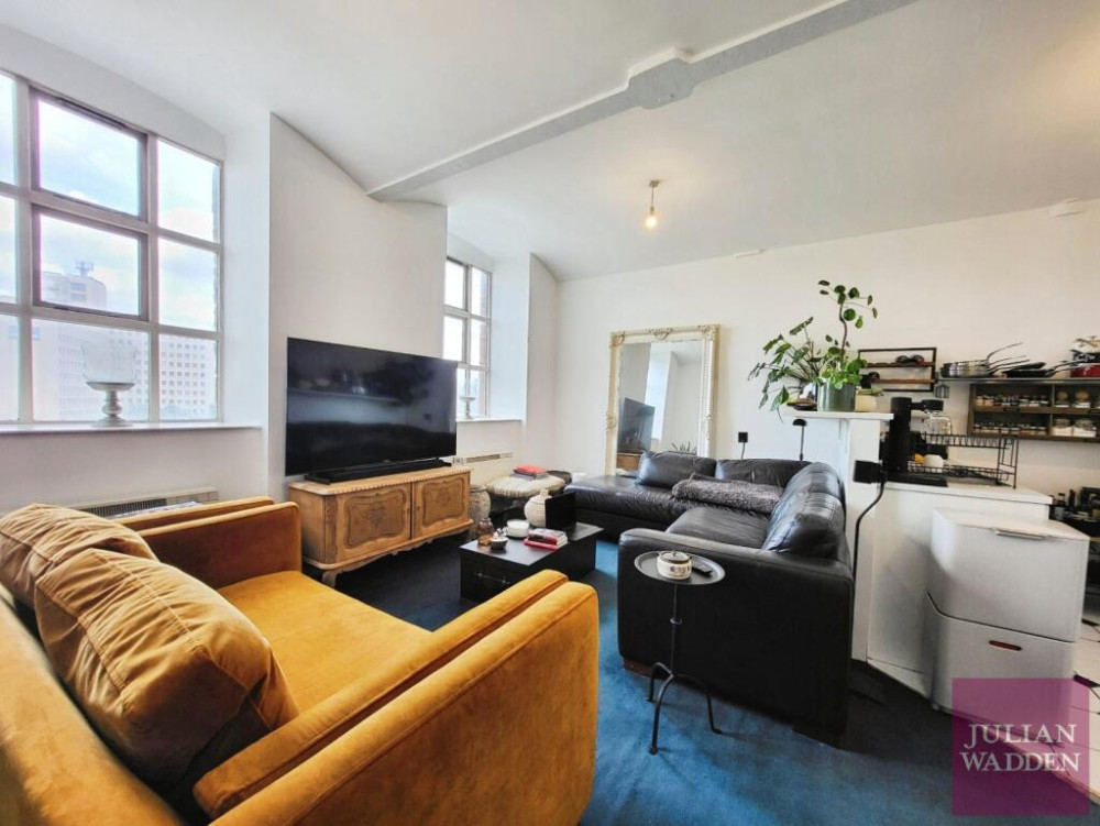 Our friends and sponsors at Julian Wadden present their property of the week - this spacious apartment in the historic Wellington Mill in Stockport town centre (Image - Julian Wadden)