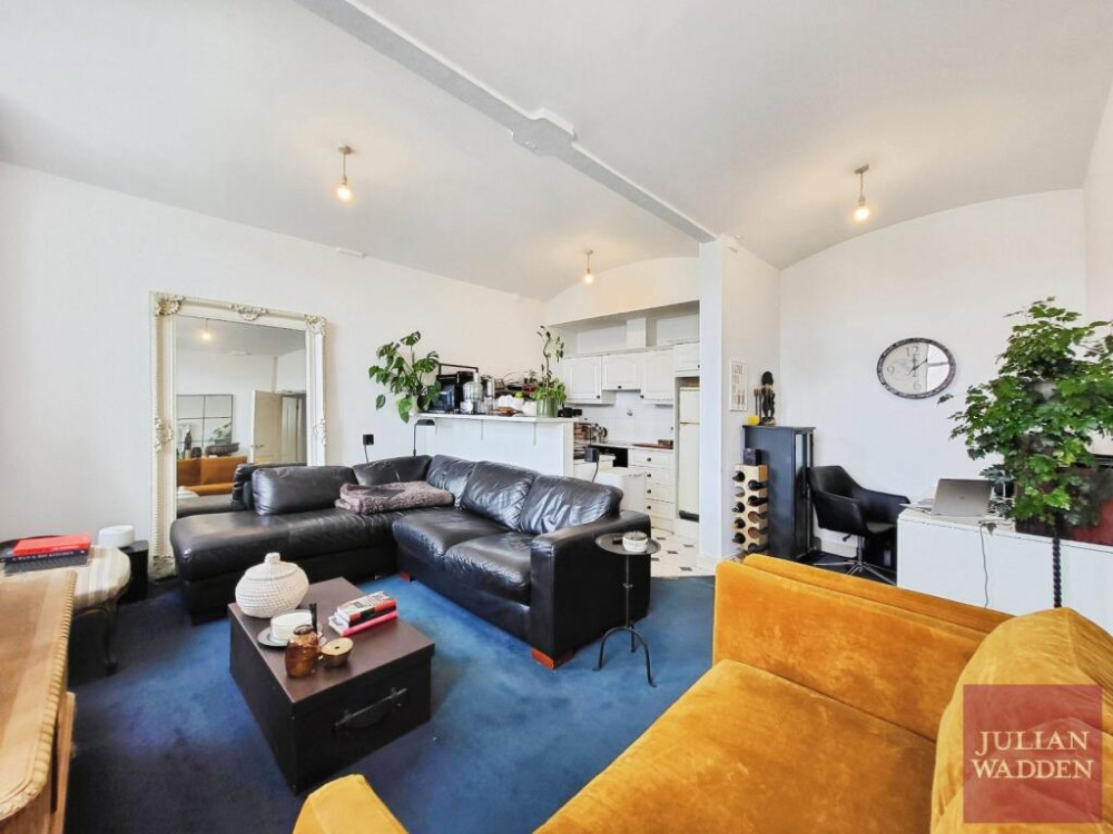 Our friends and sponsors at Julian Wadden present their property of the week - this spacious apartment in the historic Wellington Mill in Stockport town centre (Image - Julian Wadden)