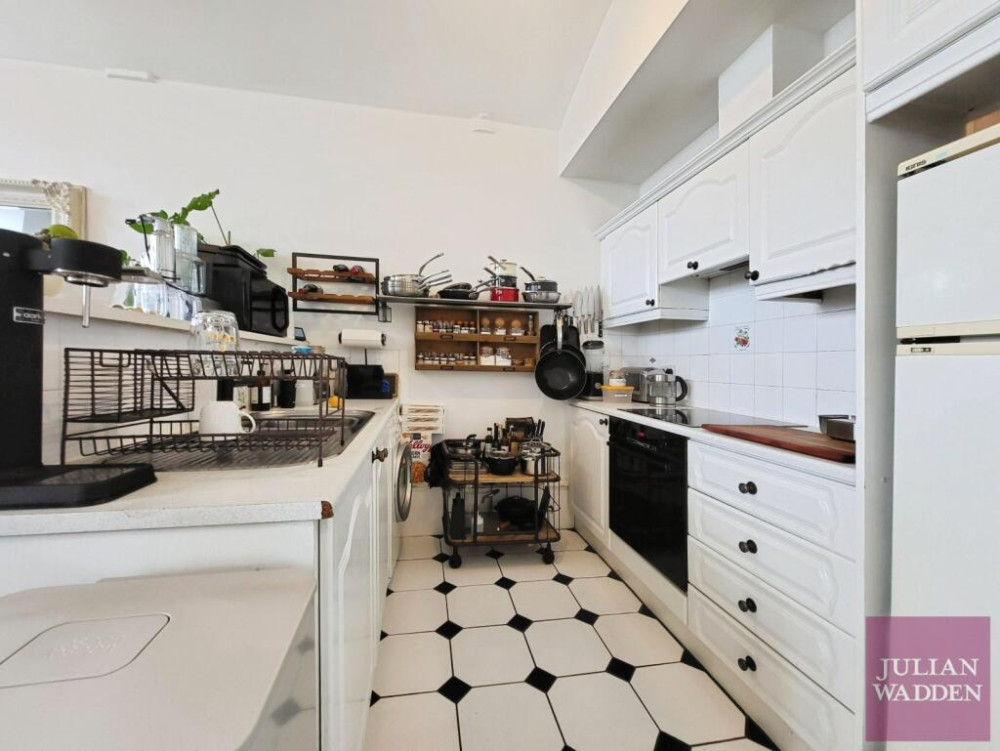 Our friends and sponsors at Julian Wadden present their property of the week - this spacious apartment in the historic Wellington Mill in Stockport town centre (Image - Julian Wadden)