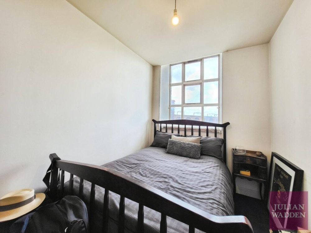 Our friends and sponsors at Julian Wadden present their property of the week - this spacious apartment in the historic Wellington Mill in Stockport town centre (Image - Julian Wadden)