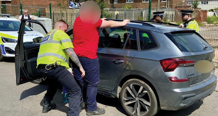 A man is searched after the car he was travelling in was pulled over.