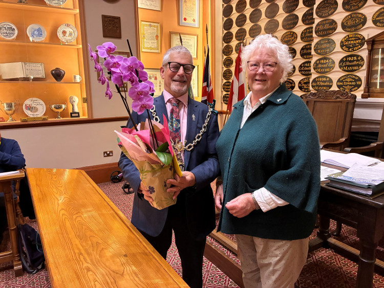 Mayor Les Fry presented flowers and a gift voucher to Cllr Mollie Rennie to mark her 40 years as a councillor.   