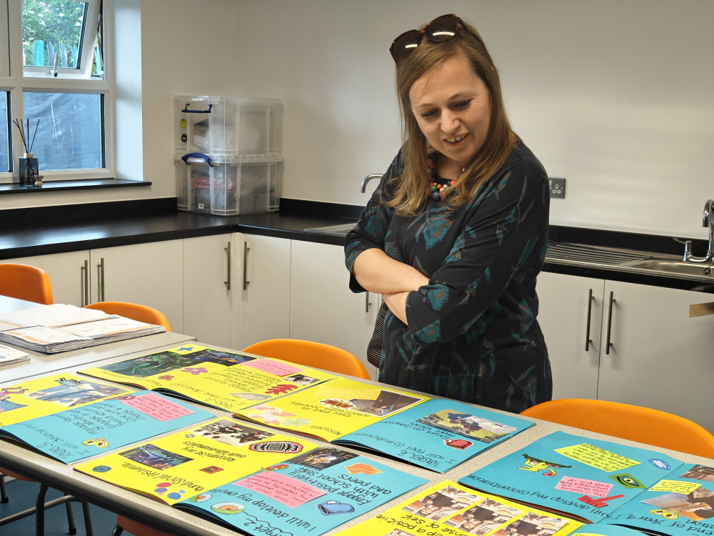 MP Jen Craft looks at some of the students' work. 