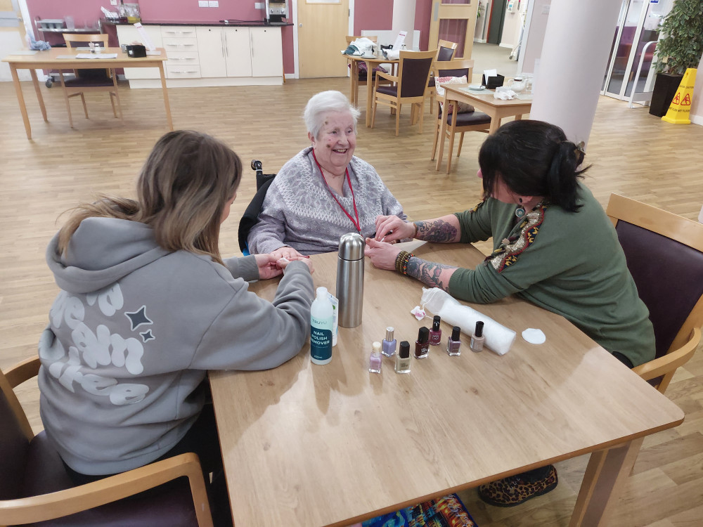 Students provide manicures to care home residents