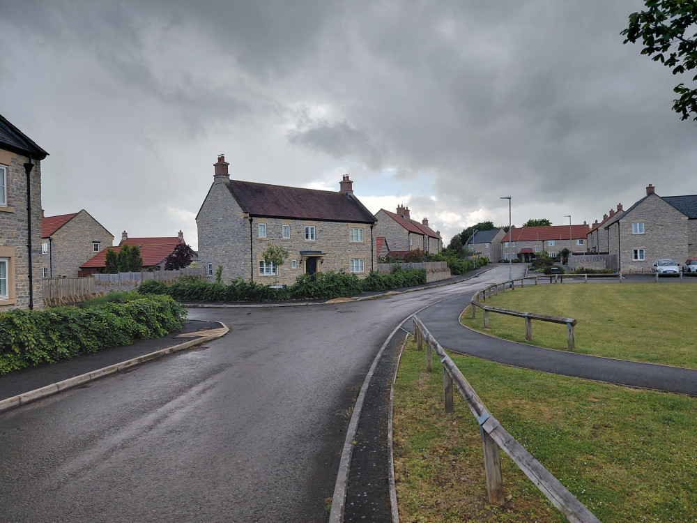 Somerset Council has taken legal action over unpaid housing contributions linked to a development later taken on by Glastonbury-based Galion Homes.