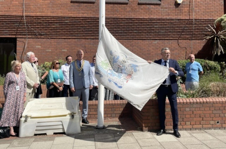 Cllr Richard Bingley with the borough flag. 