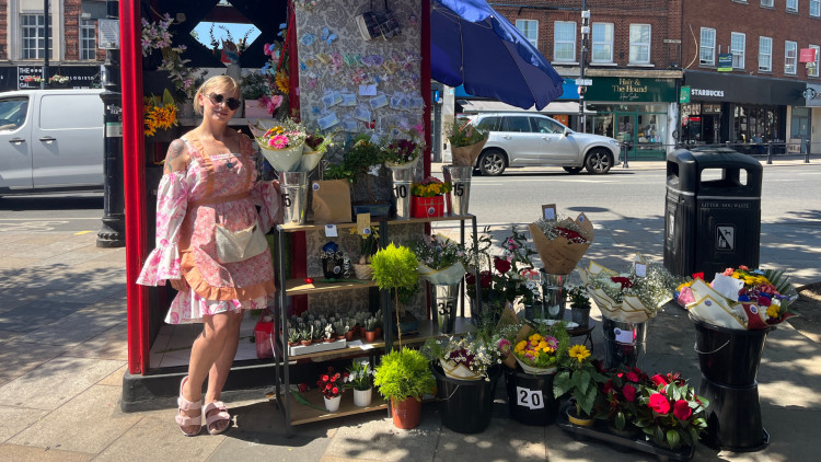 Anna Cieslak, local florist stood next to her flower stall (credit: Charlie Speed).
