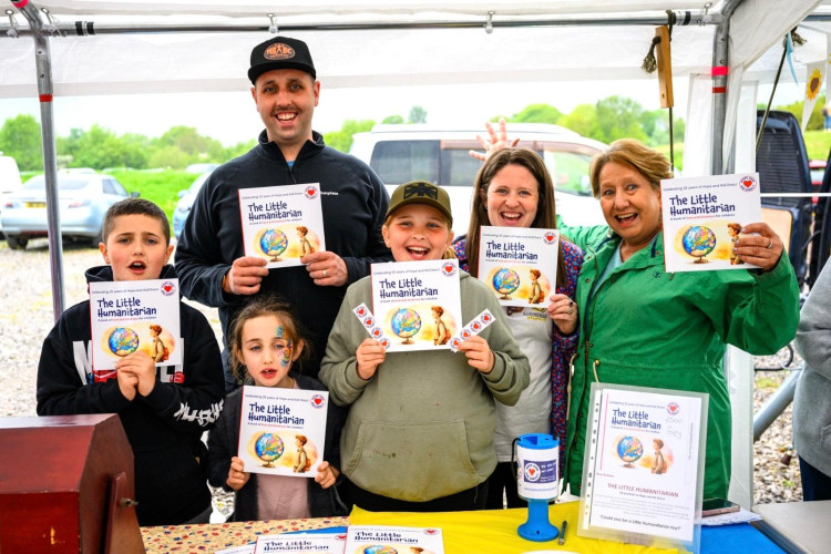Karina Meachin (right) is celebrating after selling 1,000 copies of her children's book, The Little Humanitarian (Credit: Supplied)