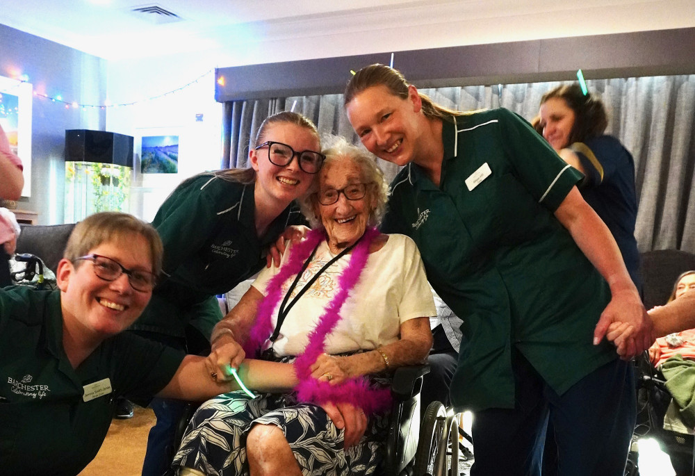 Resident Margaret had a great time at the disco, pictured here with some of the fabulous Crandon Springs care staff.