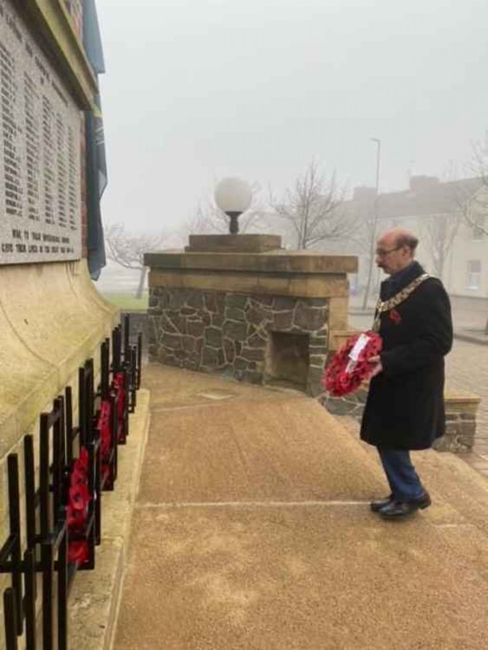 North West Leicestershire District Council Chairman Verge Richichi lays a wreath at Coalville's War Memorial with no official parade this year